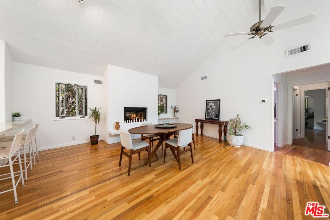 22760 Chamera Lane Topanga, CA 90290 - Photo 37 of 52 a view of a dining room with furniture and wooden floor