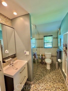 8713 Samoline Avenue Downey, CA 90240 - Photo 14 of 22 a bathroom with a sink toilet and shower