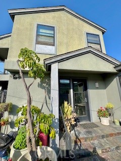 8713 Samoline Avenue Downey, CA 90240 - Photo 19 of 22 a front view of a house