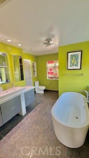 8713 Samoline Avenue Downey, CA 90240 - Photo 6 of 22 a bathroom with a sink a bathtub and a window