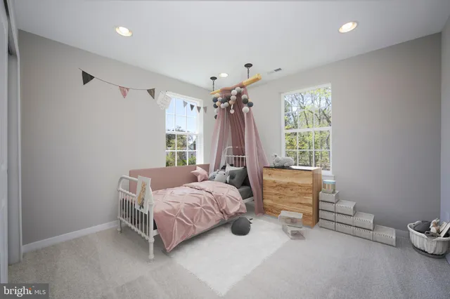 a bed room with a bed and a window