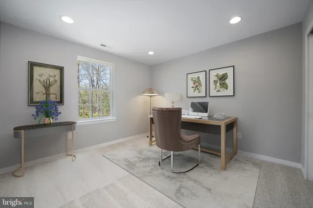 a workspace with furniture and window