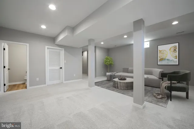 a lobby with furniture and a potted plant