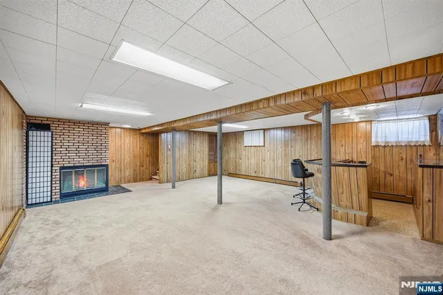 a view of an empty room with a fireplace