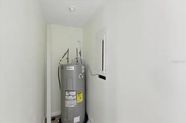 a view of an empty room with a ceiling fan