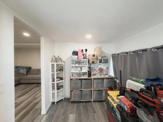 a room with furniture and wooden floor