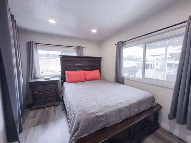 a bedroom with a bed and a window