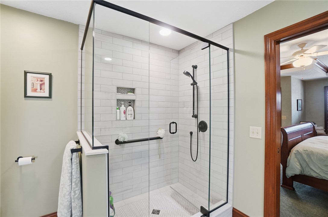 5300 Brookshire Lane Springfield, OH 45502 - Photo 32 of 56 This modern bathroom features a spacious walk-in shower with sleek glass enclosure and contemporary fixtures.