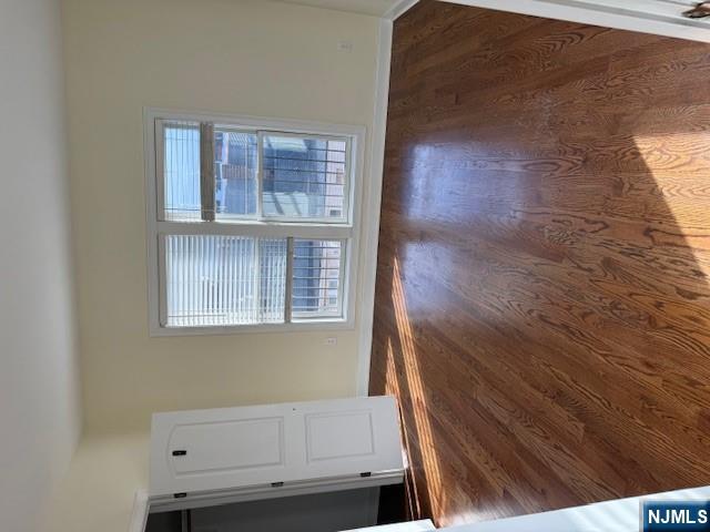 600 Frank E Rodgers Boulevard North, Unit 3 Harrison, NJ 07029 - Photo 11 of 16 a view of an empty room with wooden floor and a window