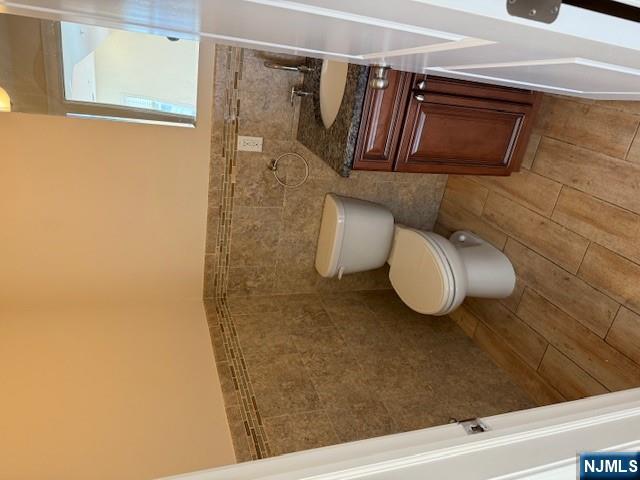 600 Frank E Rodgers Boulevard North, Unit 3 Harrison, NJ 07029 - Photo 12 of 16 a bathroom with a toilet and a sink