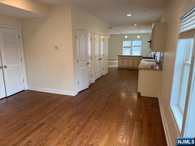 600 Frank E Rodgers Boulevard North, Unit 3 Harrison, NJ 07029 - Photo 5 of 16 a view of a hallway with wooden floor and staircase