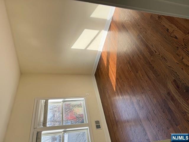 600 Frank E Rodgers Boulevard North, Unit 3 Harrison, NJ 07029 - Photo 7 of 16 a view of an empty room with wooden floor and a window