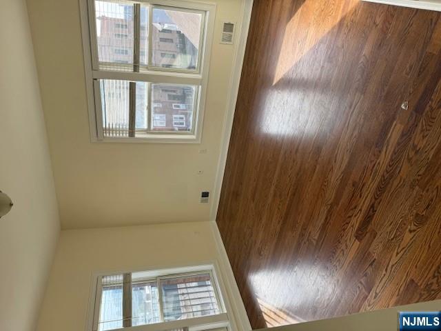 600 Frank E Rodgers Boulevard North, Unit 3 Harrison, NJ 07029 - Photo 9 of 16 a view of an empty room with wooden floor and a window