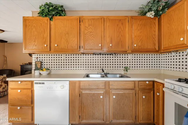 a tall house with trees in front of it