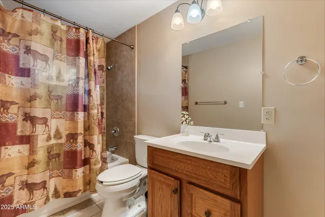 a dining room with furniture and a window