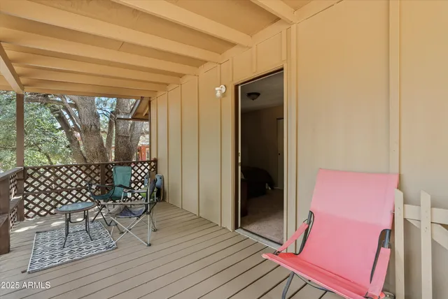 a view of a backyard with a large tree