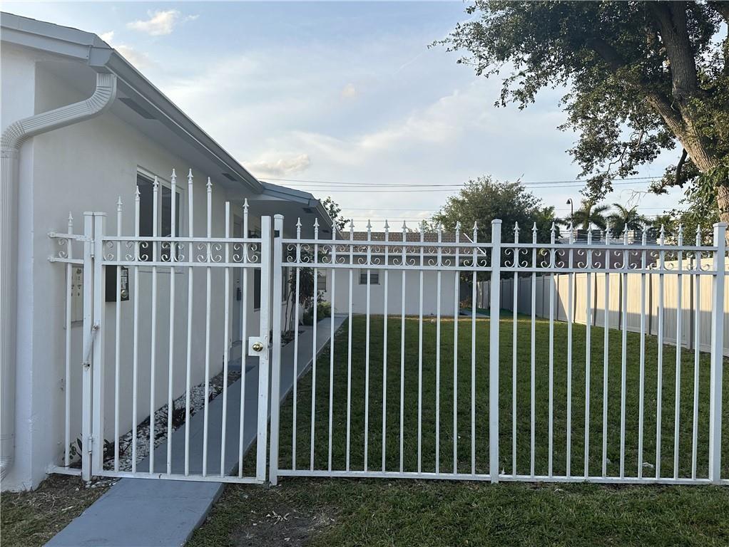 6109 Southwest 30th Street, Unit 1 Miramar, FL 33023 - Photo 1 of 11 a view of a houses with a green space