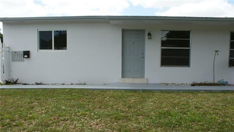 6109 Southwest 30th Street, Unit 1 Miramar, FL 33023 - Photo 2 of 11 a view of a house with backyard and porch