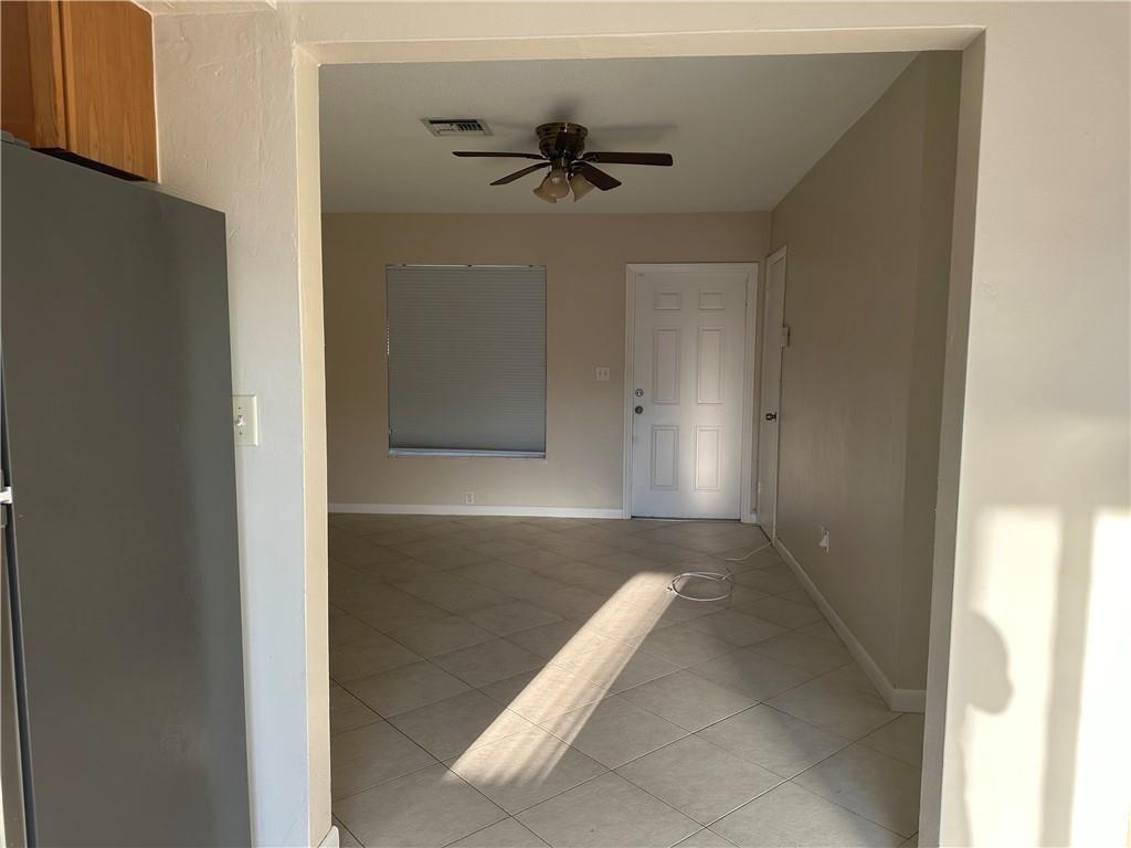 6109 Southwest 30th Street, Unit 1 Miramar, FL 33023 - Photo 6 of 11 a view of a hallway with a chandelier