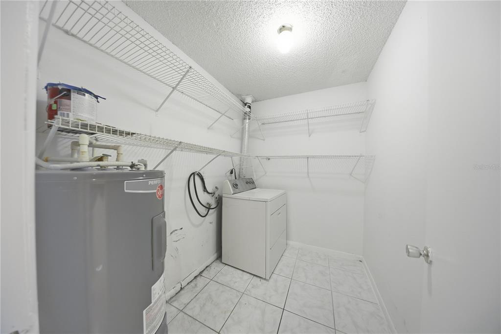1836 Southwest 109th Place Ocala, FL 34476 - Photo 11 of 16 a view of a storage & utility room with racks on the wall