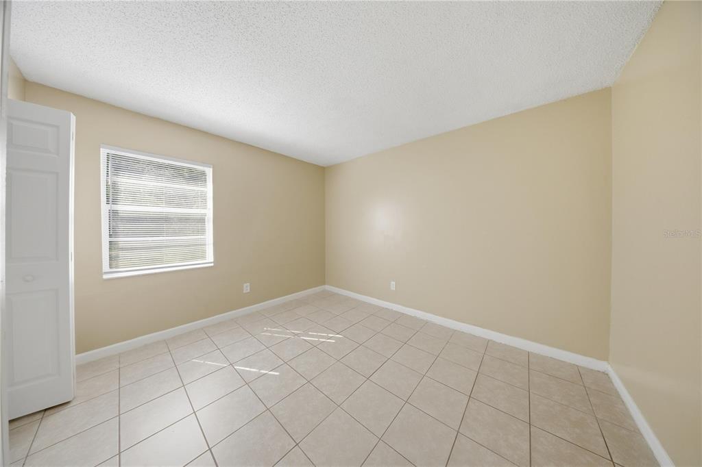 1836 Southwest 109th Place Ocala, FL 34476 - Photo 12 of 16 a view of an empty room and window