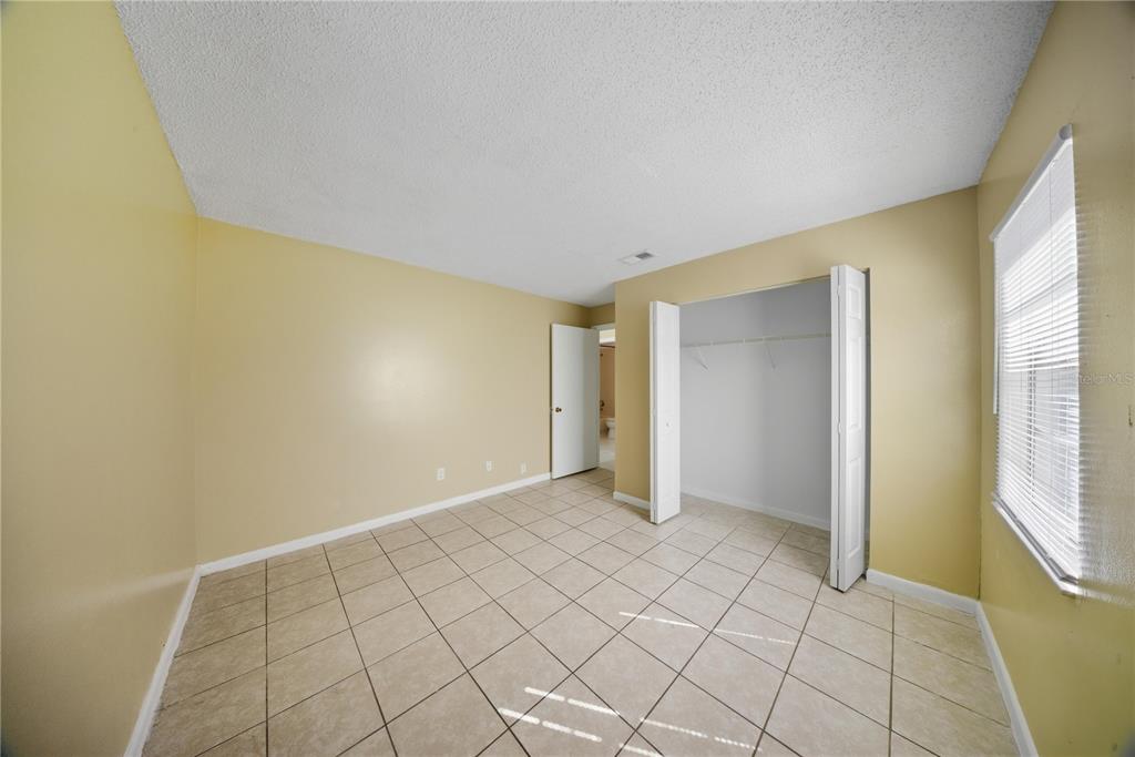 1836 Southwest 109th Place Ocala, FL 34476 - Photo 13 of 16 a view of an empty room and window