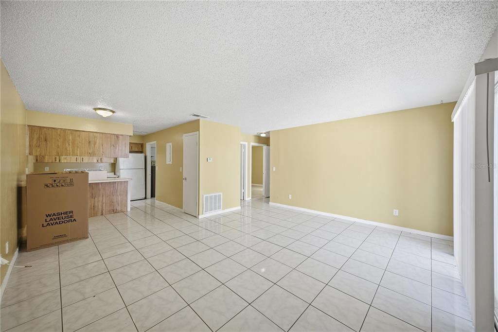 1836 Southwest 109th Place Ocala, FL 34476 - Photo 6 of 16 a view of a kitchen with furniture and an empty room