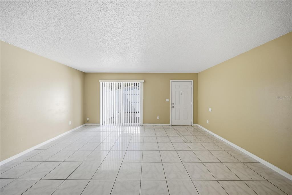 1836 Southwest 109th Place Ocala, FL 34476 - Photo 8 of 16 an empty room with windows