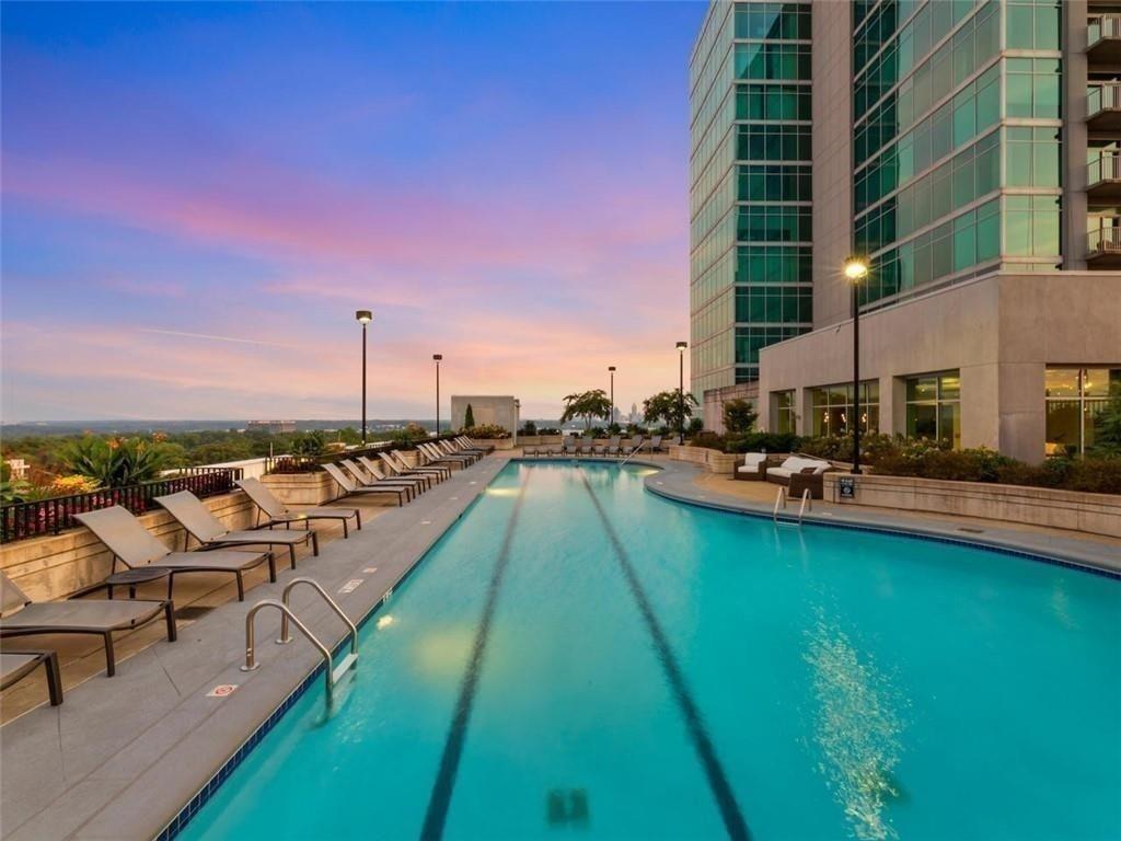 250 Pharr Road Northeast, Unit 601 Atlanta, GA 30305 - Photo 20 of 34 a view of swimming pool from a lounge chair