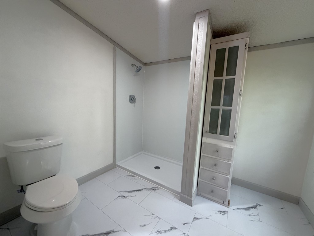161 Farm To Market 1617 Trinity, TX 75862 - Photo 11 of 15 a bathroom with a toilet and a shower