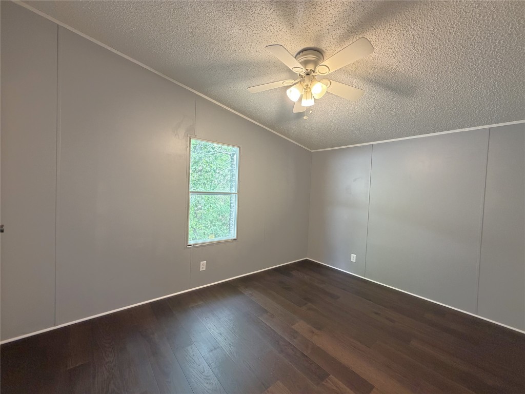 161 Farm To Market 1617 Trinity, TX 75862 - Photo 14 of 15 an empty room with wooden floor fan and windows