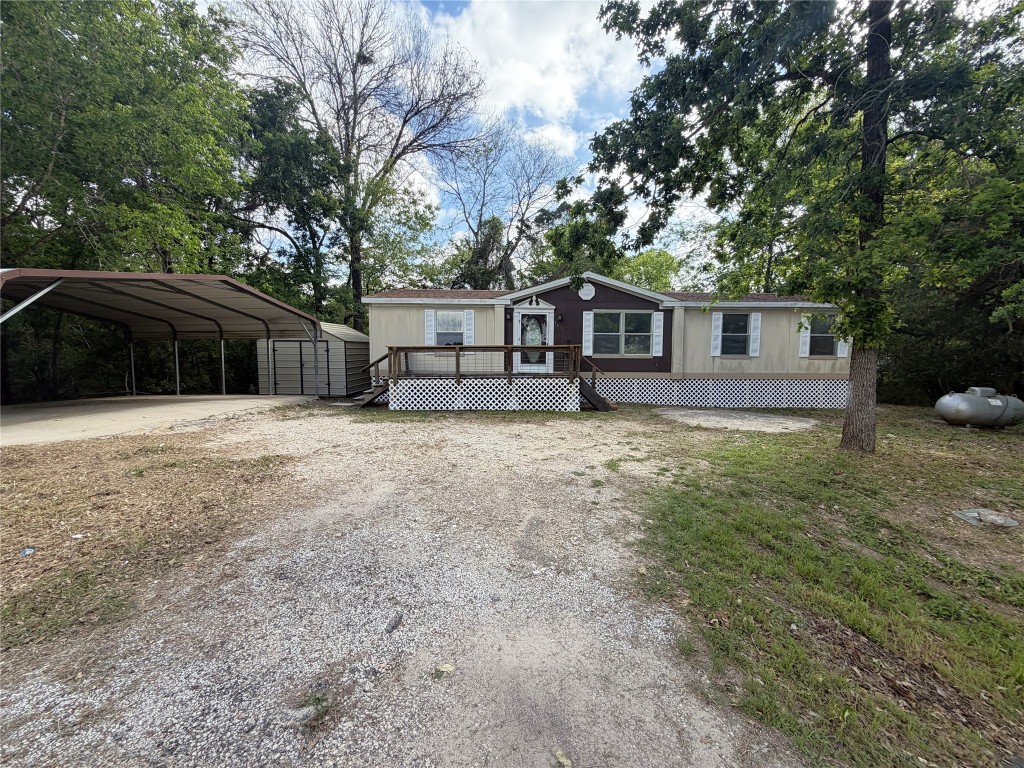 161 Farm To Market 1617 Trinity, TX 75862 - Photo 2 of 15 a view of a house with a yard and large trees
