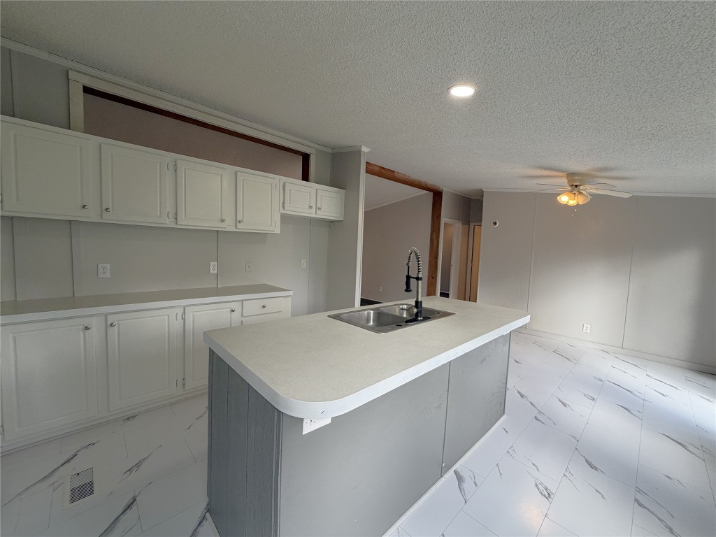 161 Farm To Market 1617 Trinity, TX 75862 - Photo 7 of 15 a kitchen with a sink a stove and cabinets