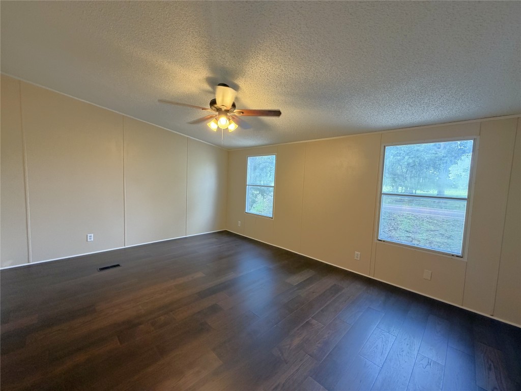 161 Farm To Market 1617 Trinity, TX 75862 - Photo 8 of 15 a view of an empty room with wooden floor and a window