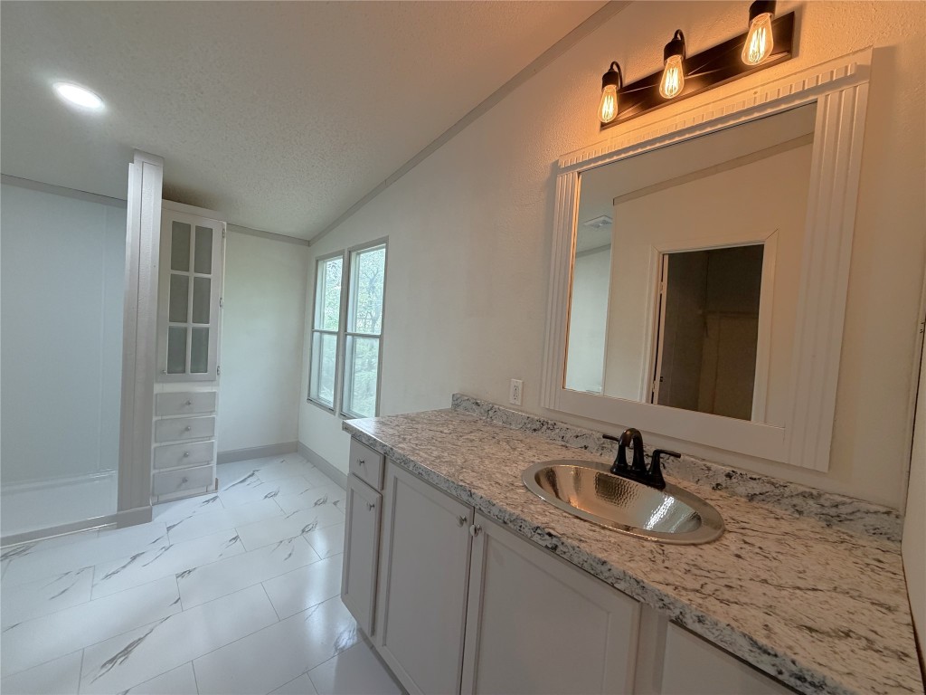 161 Farm To Market 1617 Trinity, TX 75862 - Photo 10 of 15 a bathroom with a granite countertop sink and a mirror