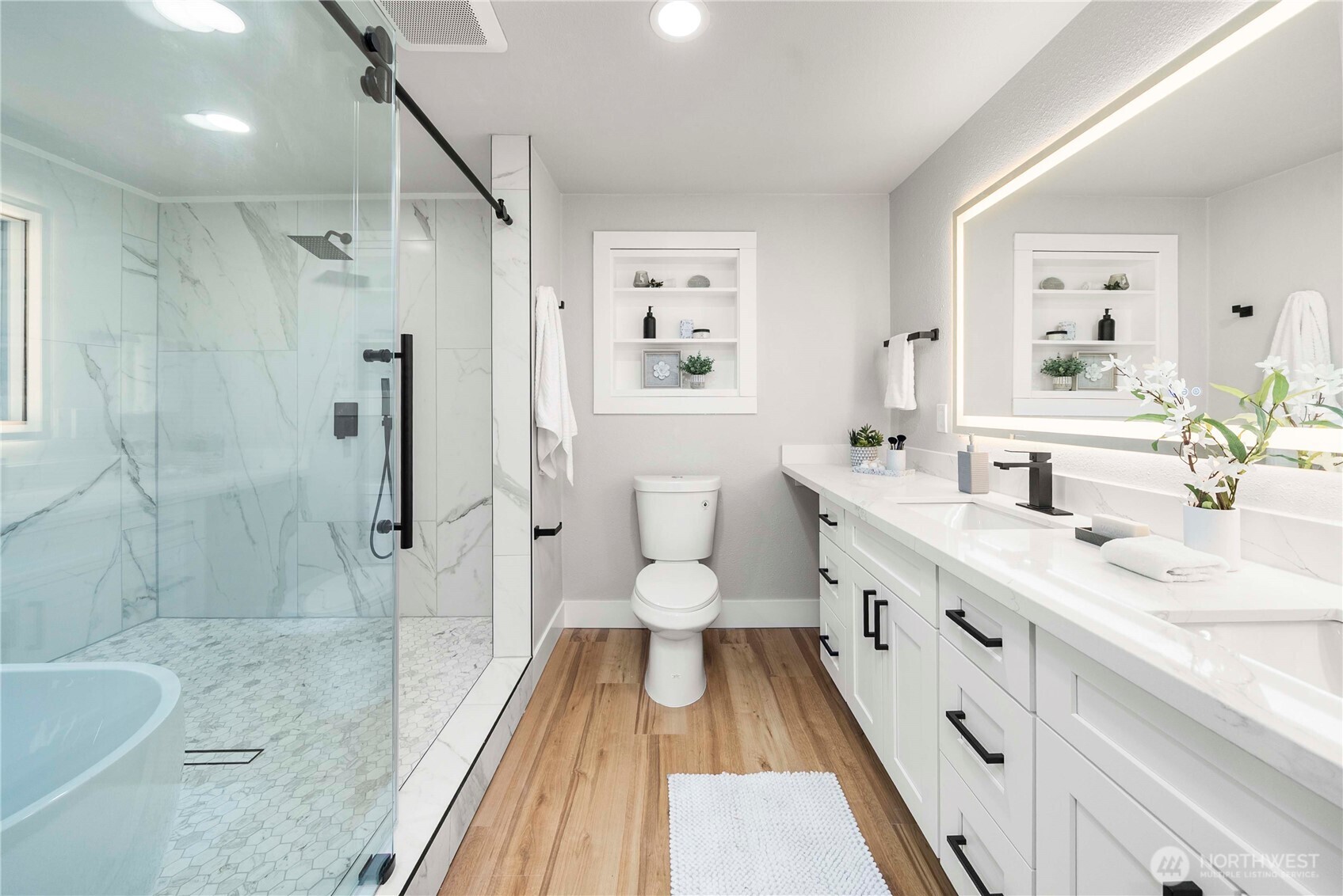 30150 10th Avenue Southwest Federal Way, WA 98023 - Photo 17 of 40 a spacious bathroom with a double vanity sink a toilet a mirror and a shower