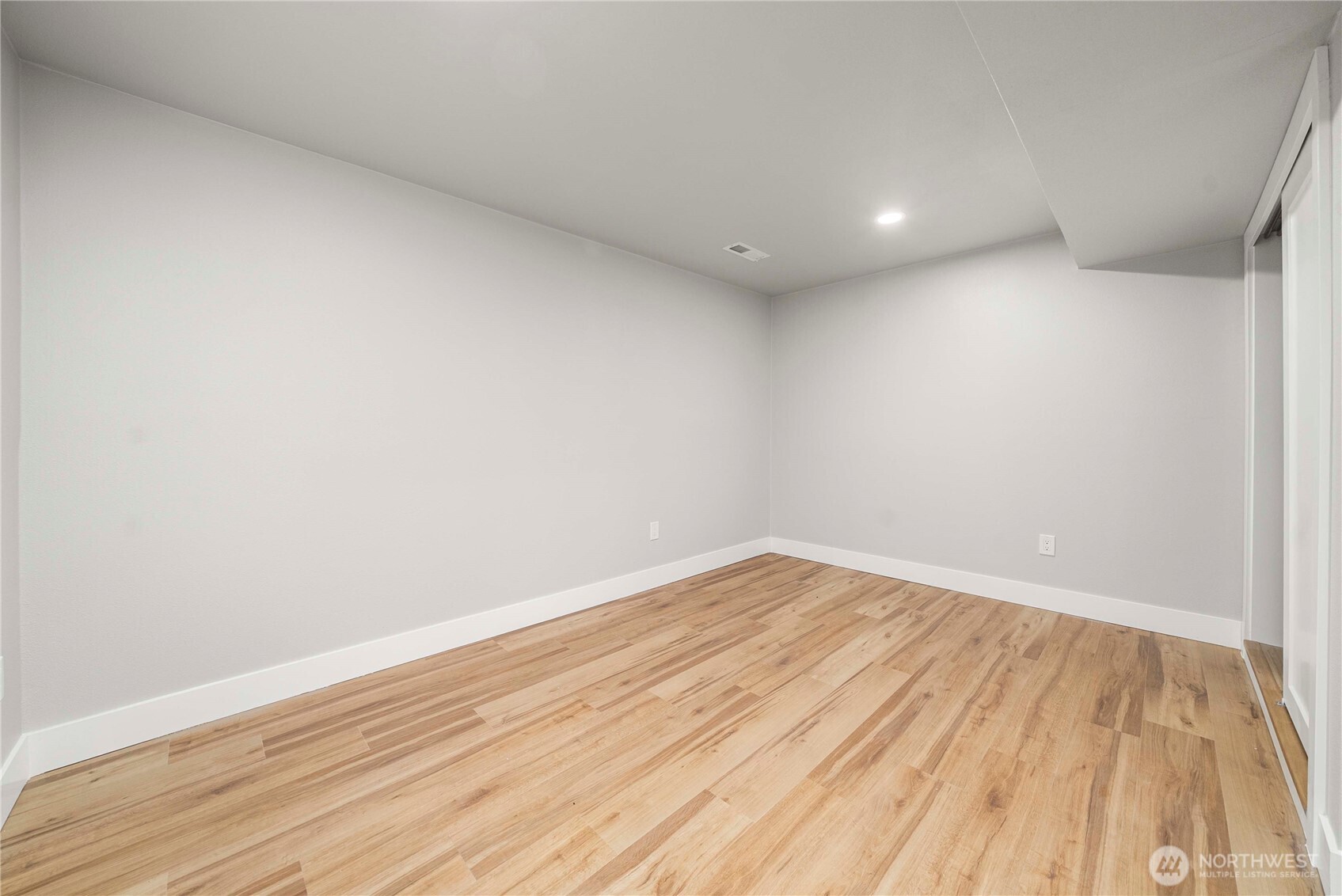 30150 10th Avenue Southwest Federal Way, WA 98023 - Photo 27 of 40 a view of empty room with wooden floor