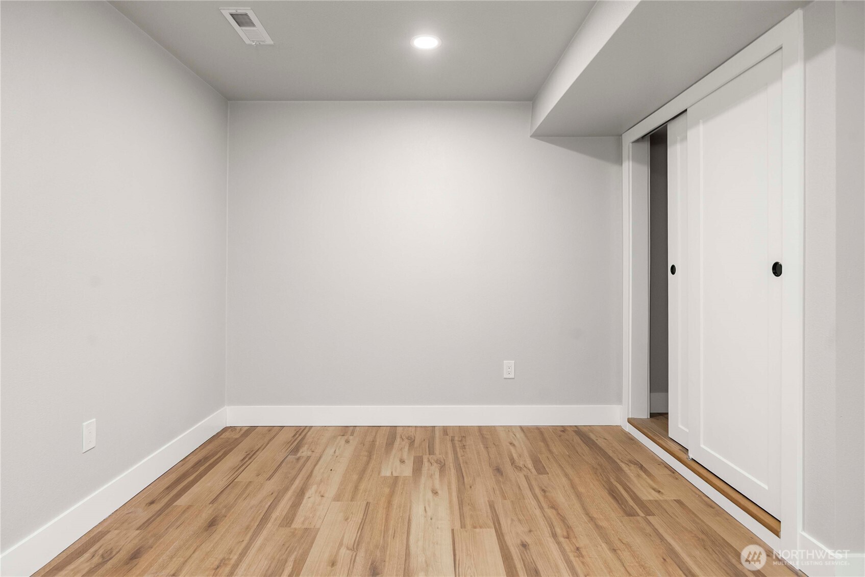 30150 10th Avenue Southwest Federal Way, WA 98023 - Photo 28 of 40 a view of an empty room with wooden floor