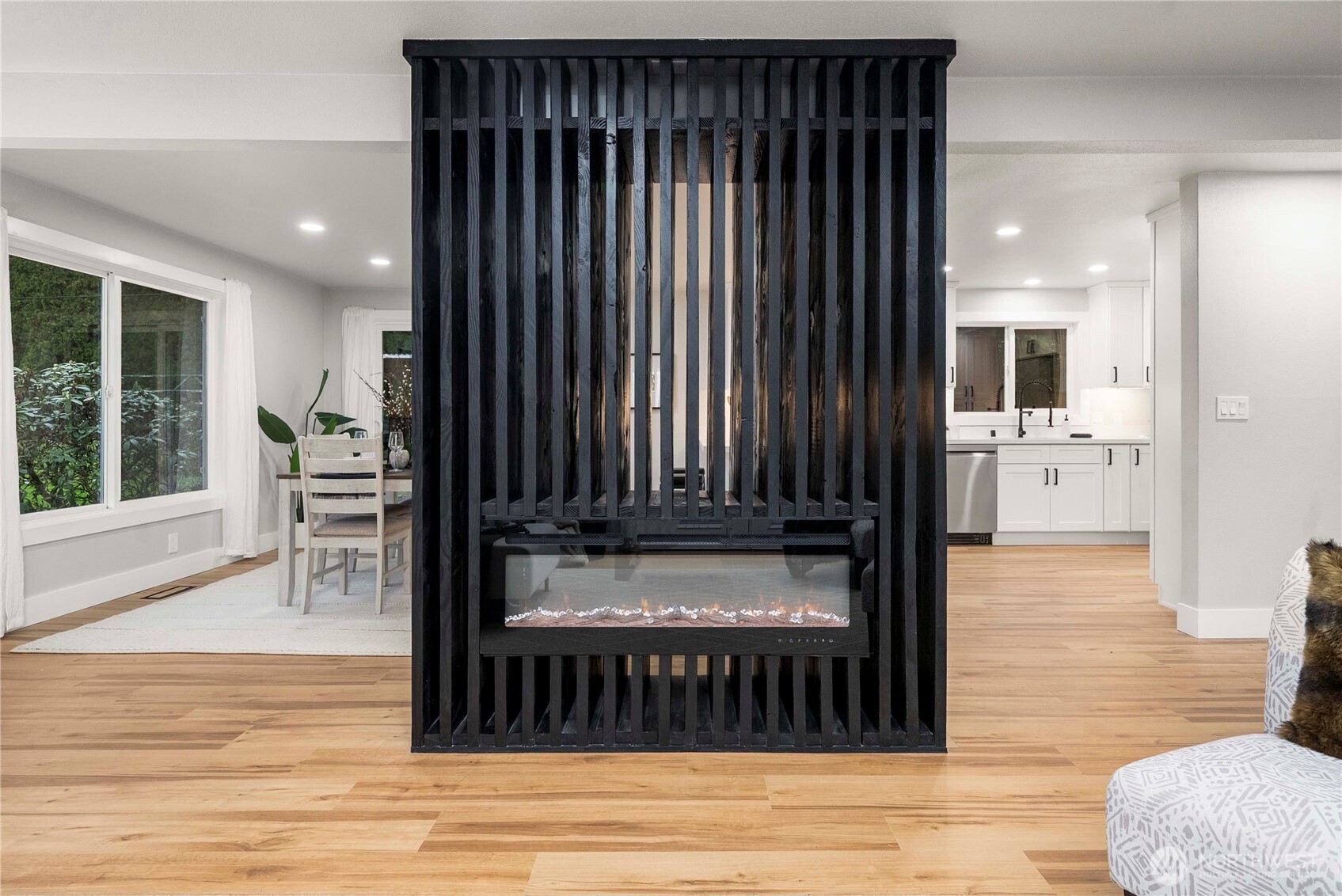 30150 10th Avenue Southwest Federal Way, WA 98023 - Photo 5 of 40 a view of a living room and kitchen with furniture wooden floor and a rug