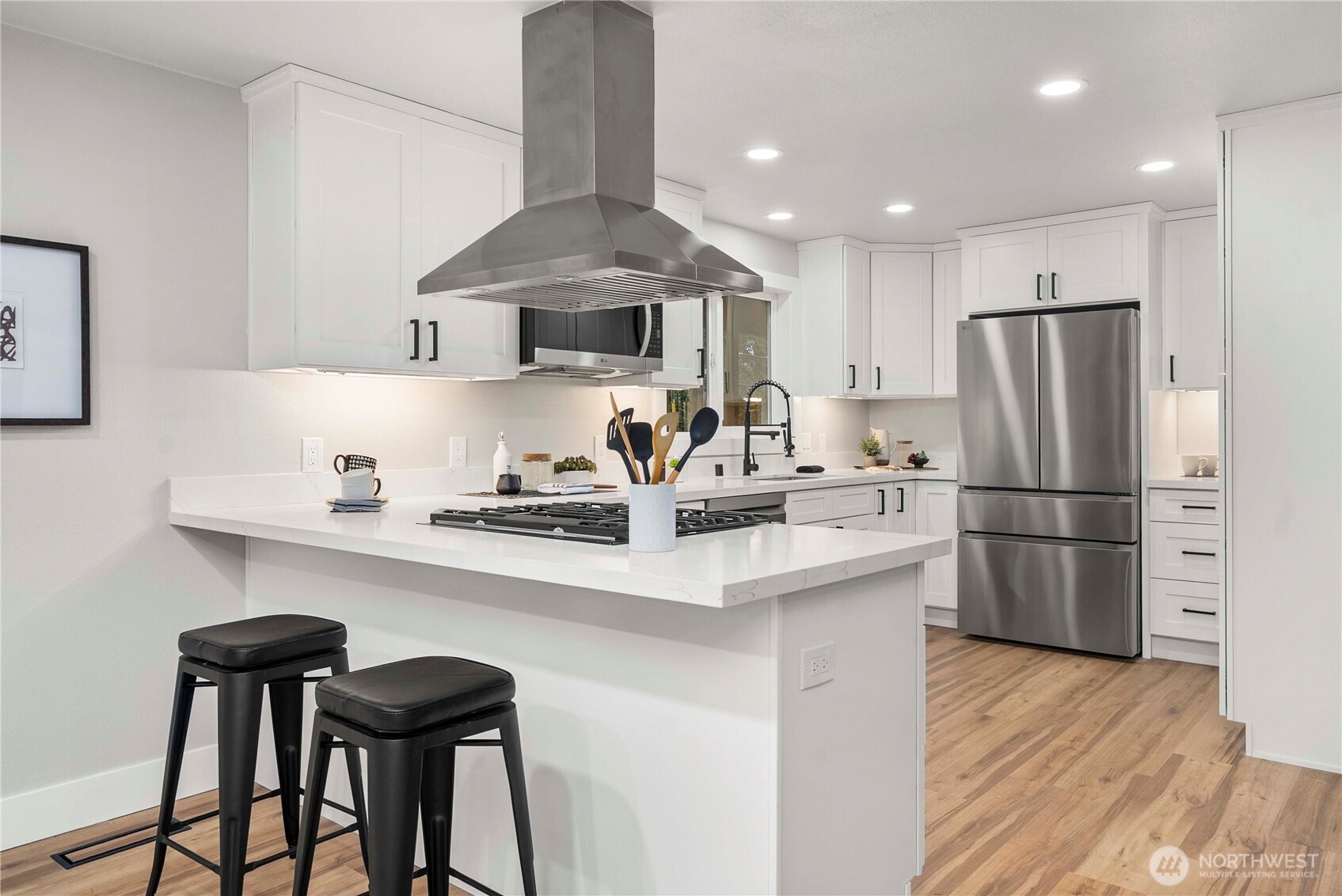 30150 10th Avenue Southwest Federal Way, WA 98023 - Photo 8 of 40 a kitchen with stainless steel appliances a sink a stove a refrigerator and cabinets