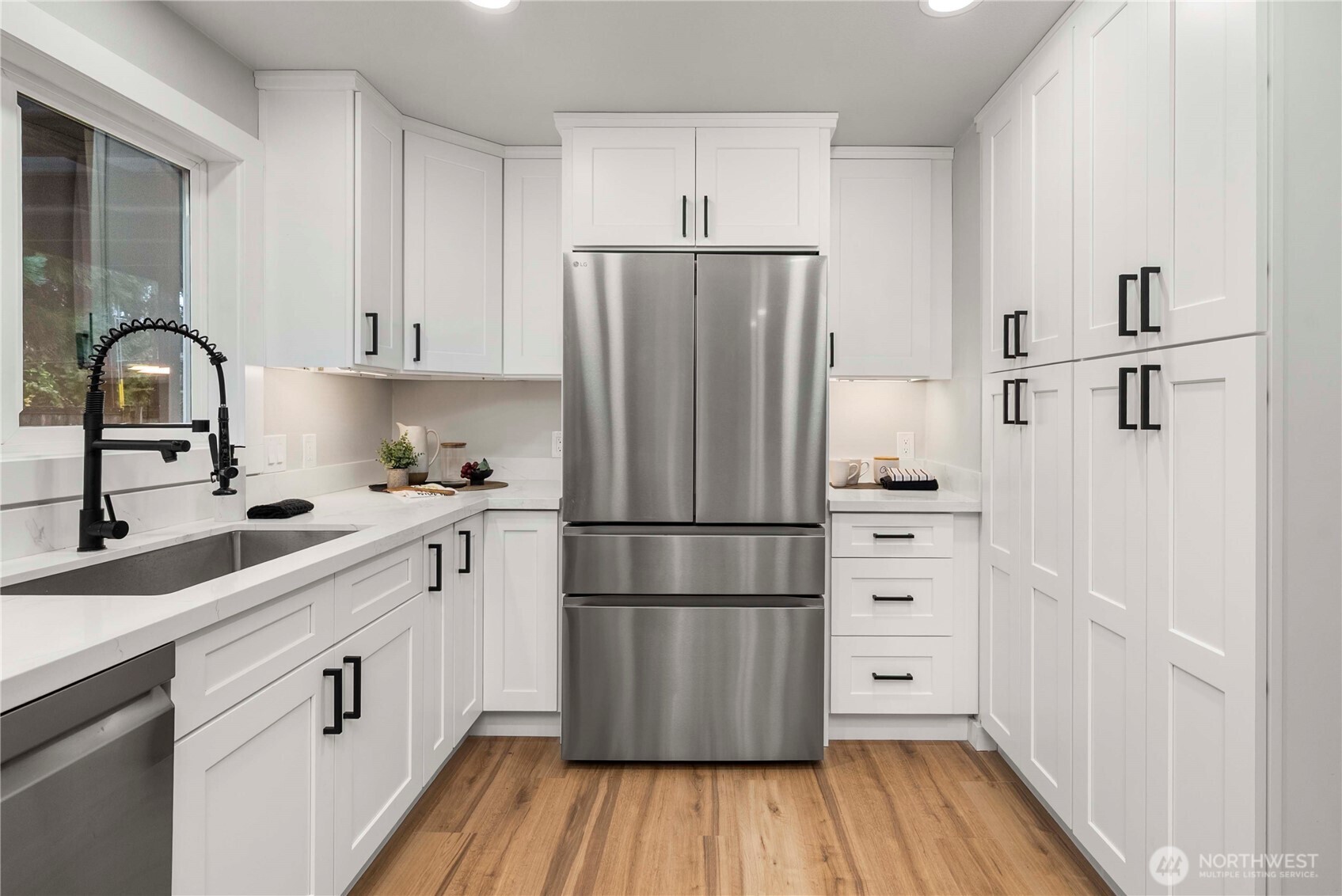 30150 10th Avenue Southwest Federal Way, WA 98023 - Photo 10 of 40 a kitchen with appliances a sink and a hard wood floor