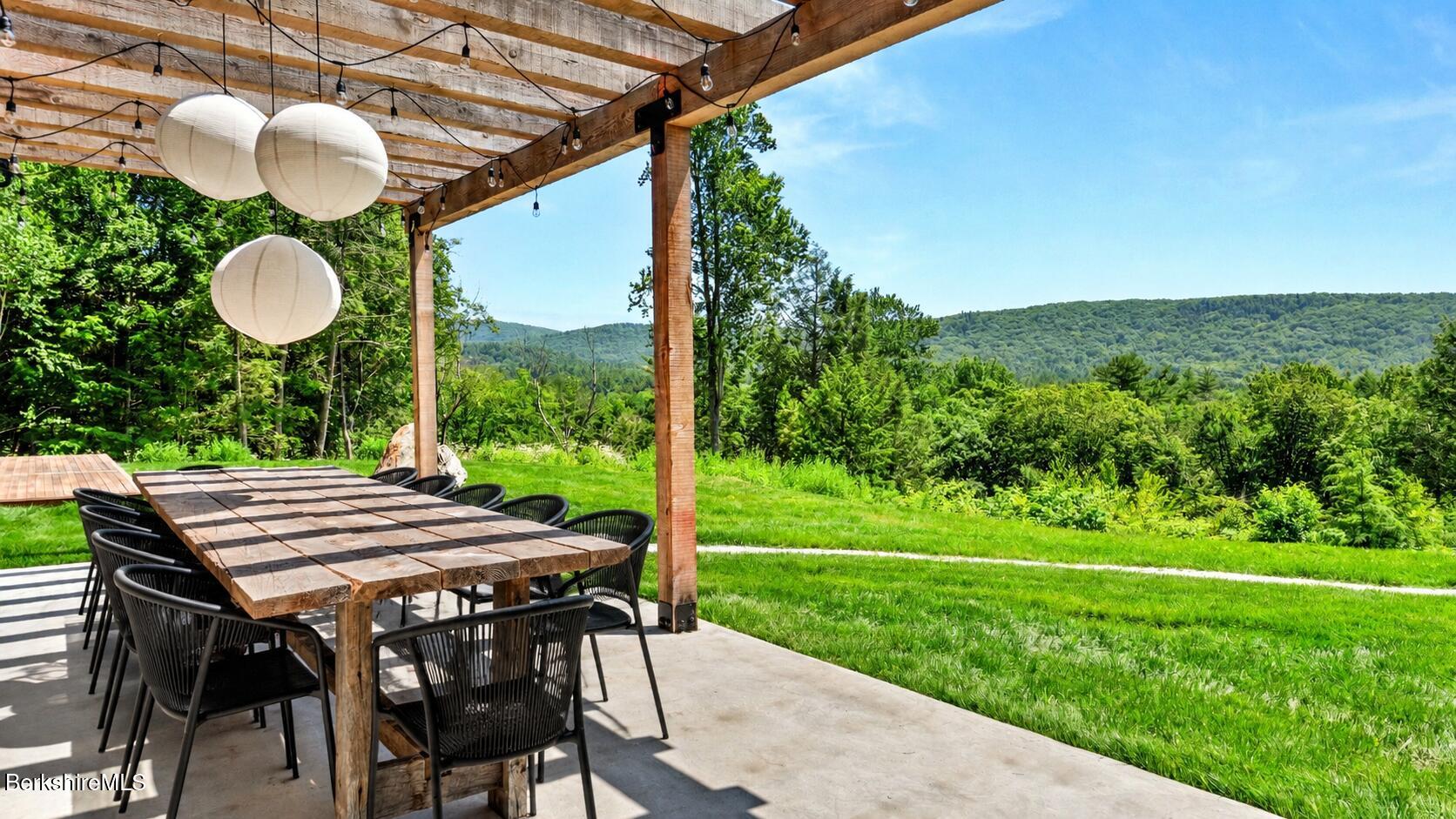 40 East Alford Road West Stockbridge, MA 01266 - Photo 15 of 50 a view of a patio with a table chairs and a table