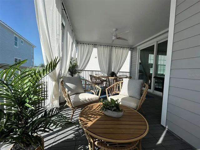 an outdoor dining space with furniture