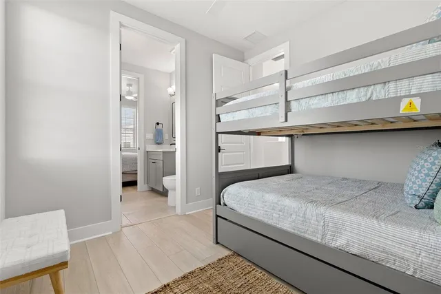 a bedroom with a bed and cabinets