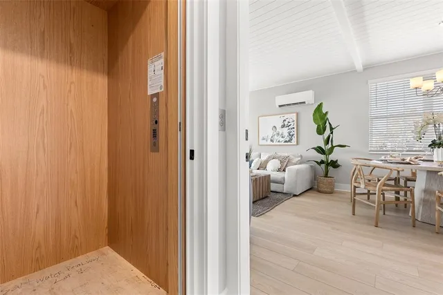 a view of a bedroom with furniture and window