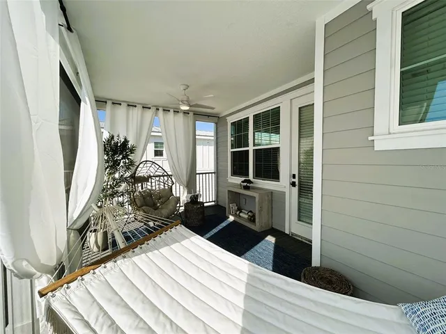a room with wooden floor and furniture