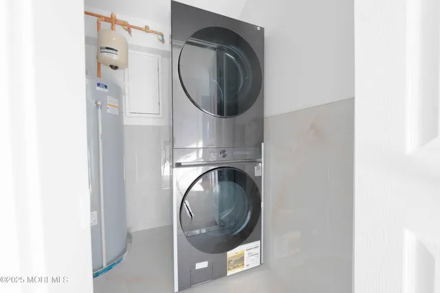 a bathroom with a toilet sink vanity and mirror