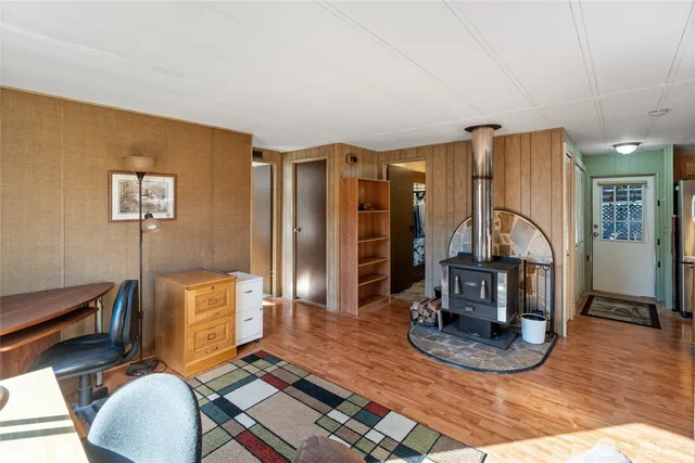 a view of a livingroom with furniture and a flat screen tv