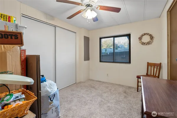 a bedroom with furniture and window