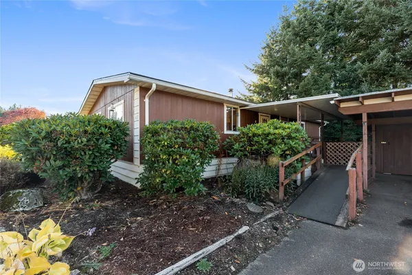 a front view of a house with garden